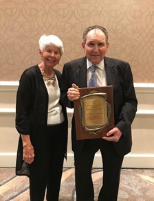 Charles E. Simpson and wife Lynnann with award plaque 